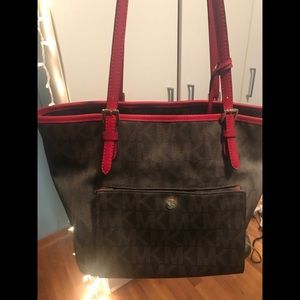 Michael Kors jet set with red trim purse
